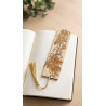 Engraved Wooden Bookmark – Floral Design with Golden Tassel on a notebook