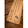Back view of the top of the Quicksilver wooden bookmark, zoomed-in details of the engraving and paint