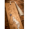 Front view of the top of the Quicksilver wooden bookmark, zoomed-in details of the engraving and paint